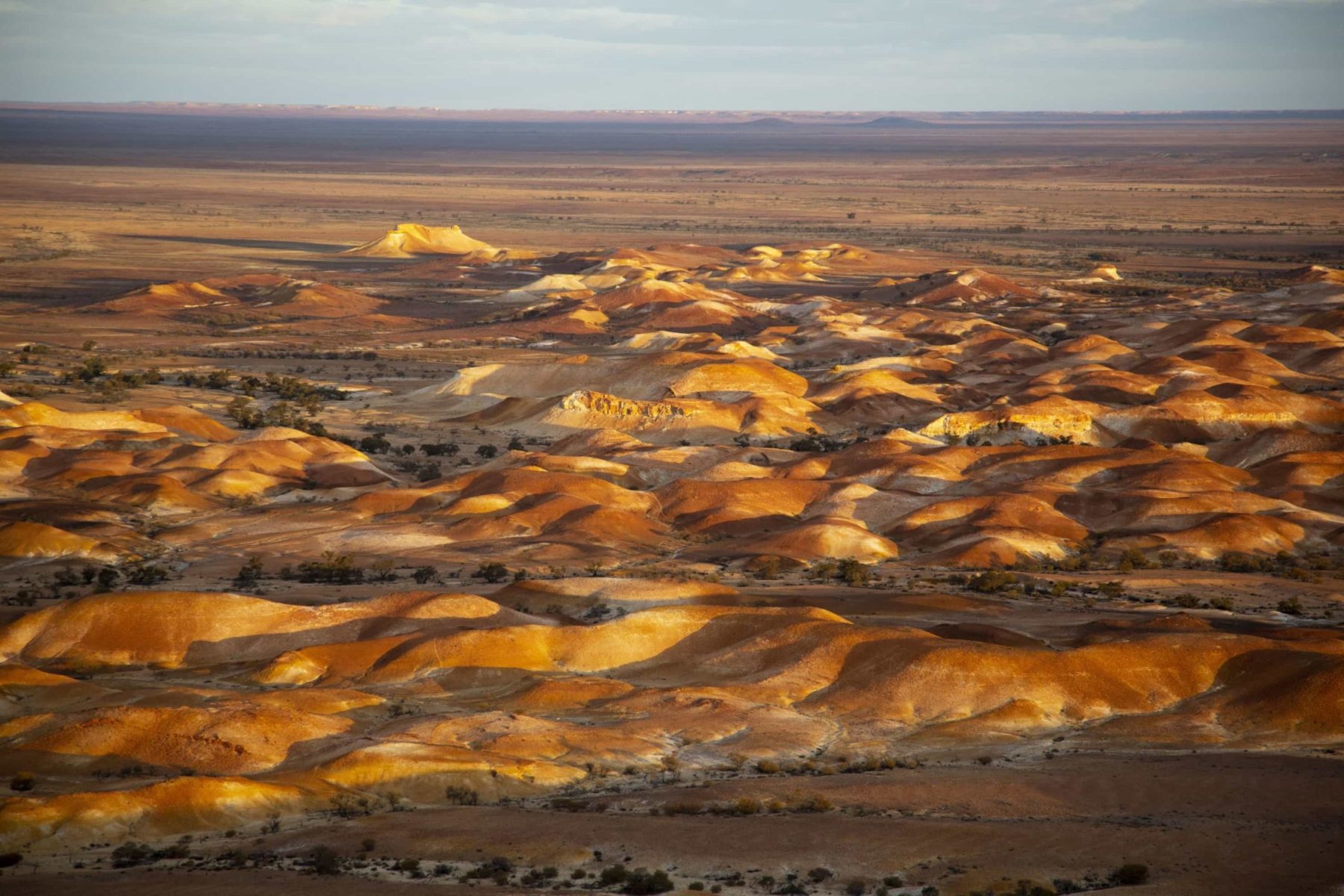 The colours of the Painted Hills are amplified by the setting sun.