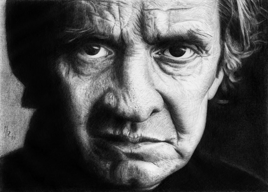 A black and white portrait of Johnny Cash