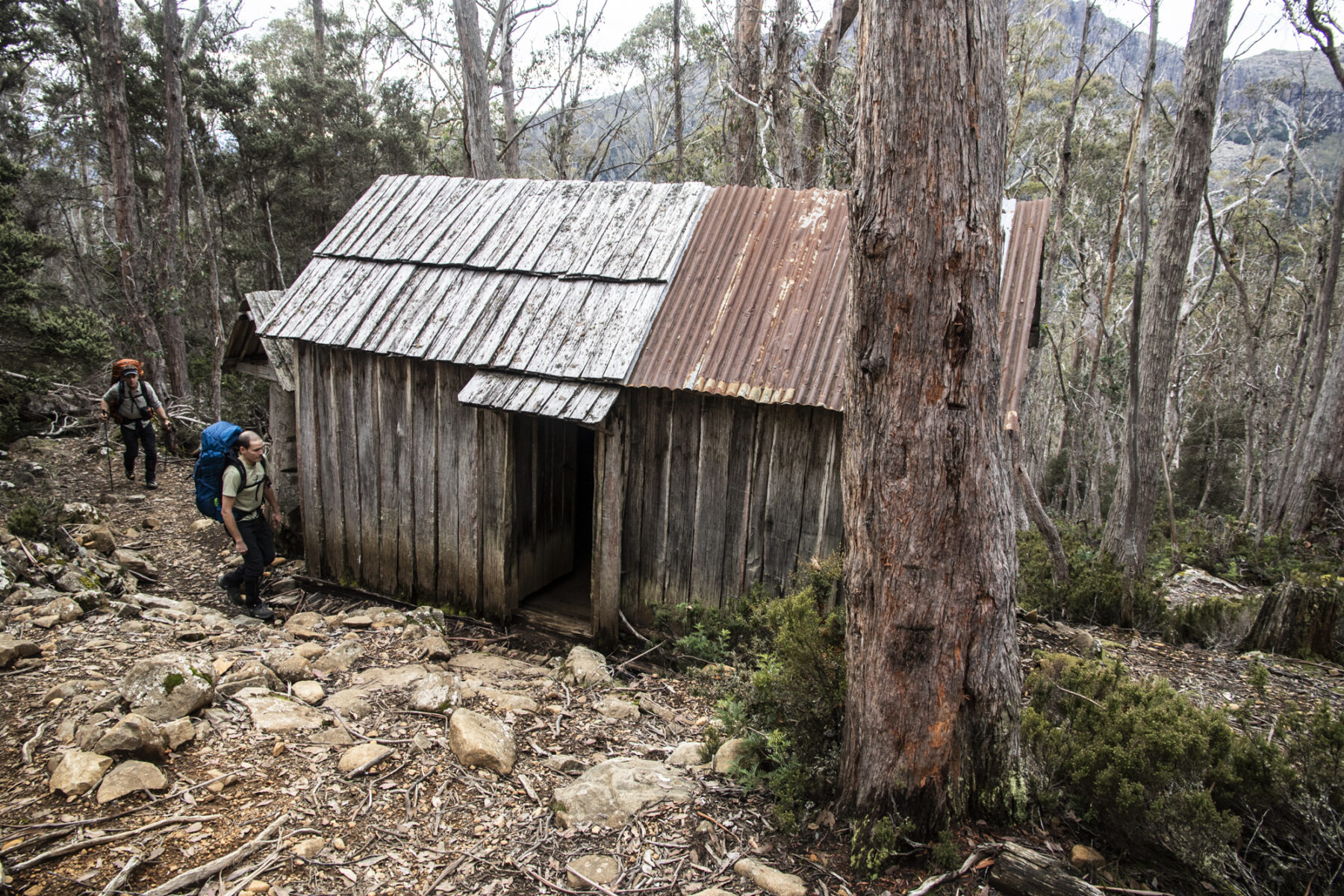 Hikers passing a hut on the Walls of Jerusalem trek