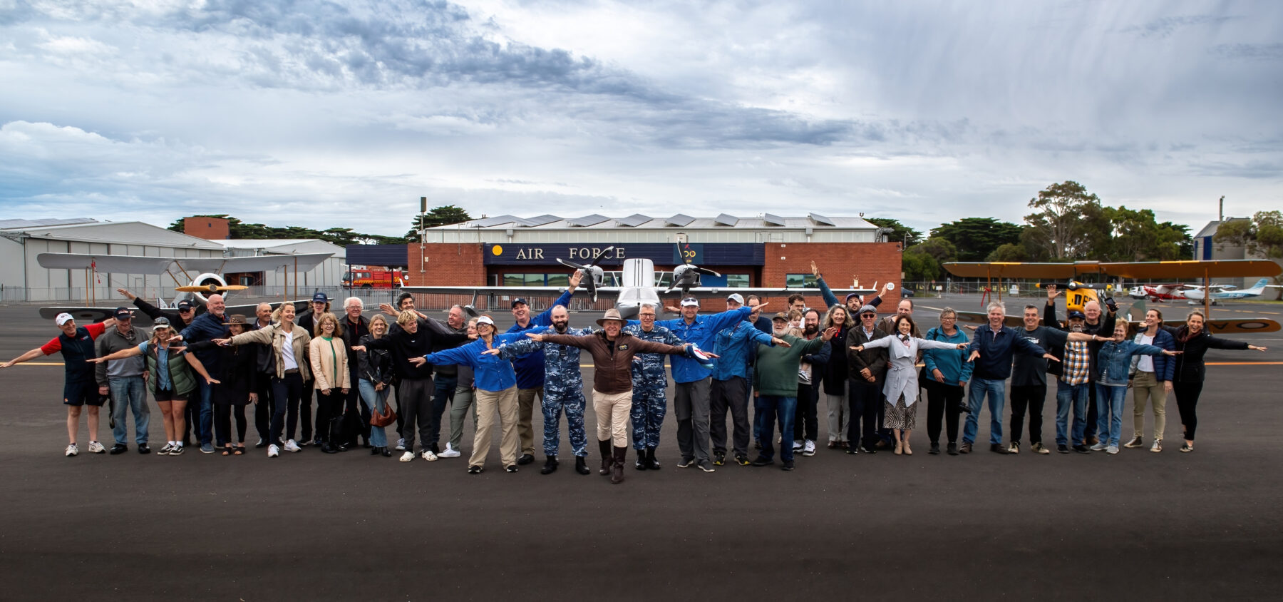 In front of two aircraft of the RAAF 100 Squadron, a (left) Sopwith Pup, and the (right) de Havilland Tiger Moth, with the (center) Chaika LLC L65 Seabear Southern Sun family, friends and supporters of Michael Smith, 2016 Adventurer of the Year pose for a group photo before he leaves to recreate the first circumnavigation of Australia that took place 100 years ago.   *** Local Caption *** Adventurer, Michael Smith is flying solo around the Australian coastline to
commemorate the 100th anniversary of the first flight around Australia by Air Forces acting Chief of the Air Staff, Wing Commander S.J. (Jimmy) Goble, and pilot, Flying Officer Ivor McIntyre in the original Fairey IIID seaplane A10-3. Starting from the Royal Australian Air Force (RAAF) base
in Point Cook, outside Melbourne in his seaplane SouthernSun twin engine Chaika LLC L65 Seabear. Image Credit: Michael Currie, RAAF