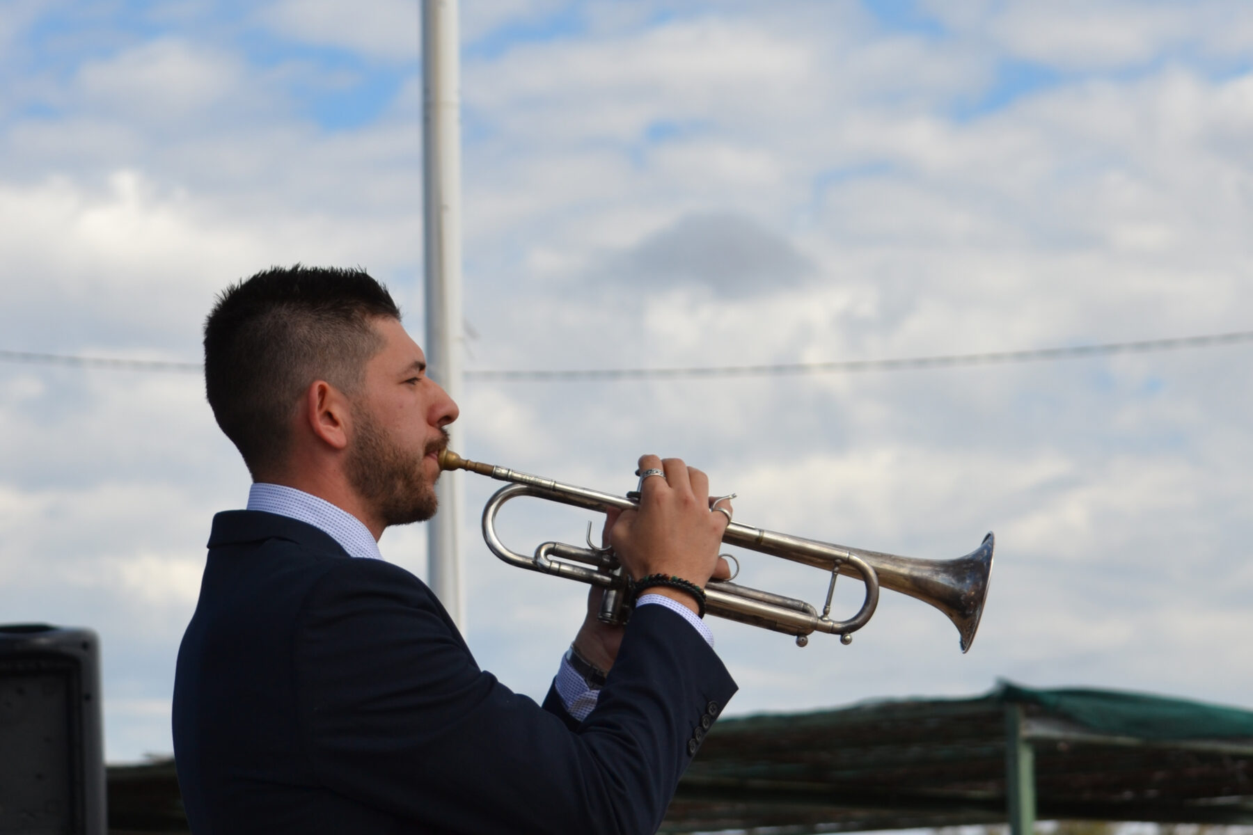 Bugler Lucas Schembri playing the trumpet.