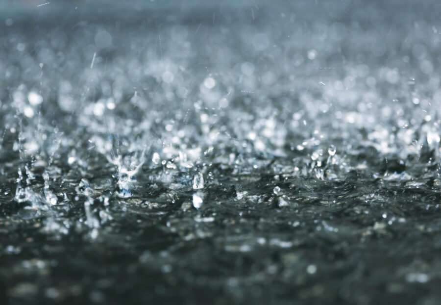 drops of heavy rain on the ground during a storm