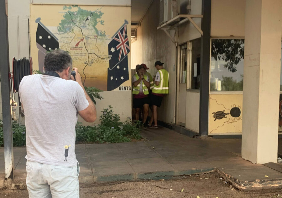 Photographer Thomas Wielecki gets some shots of solar team members at the roadhouse toilets in Dunmarra, NT.