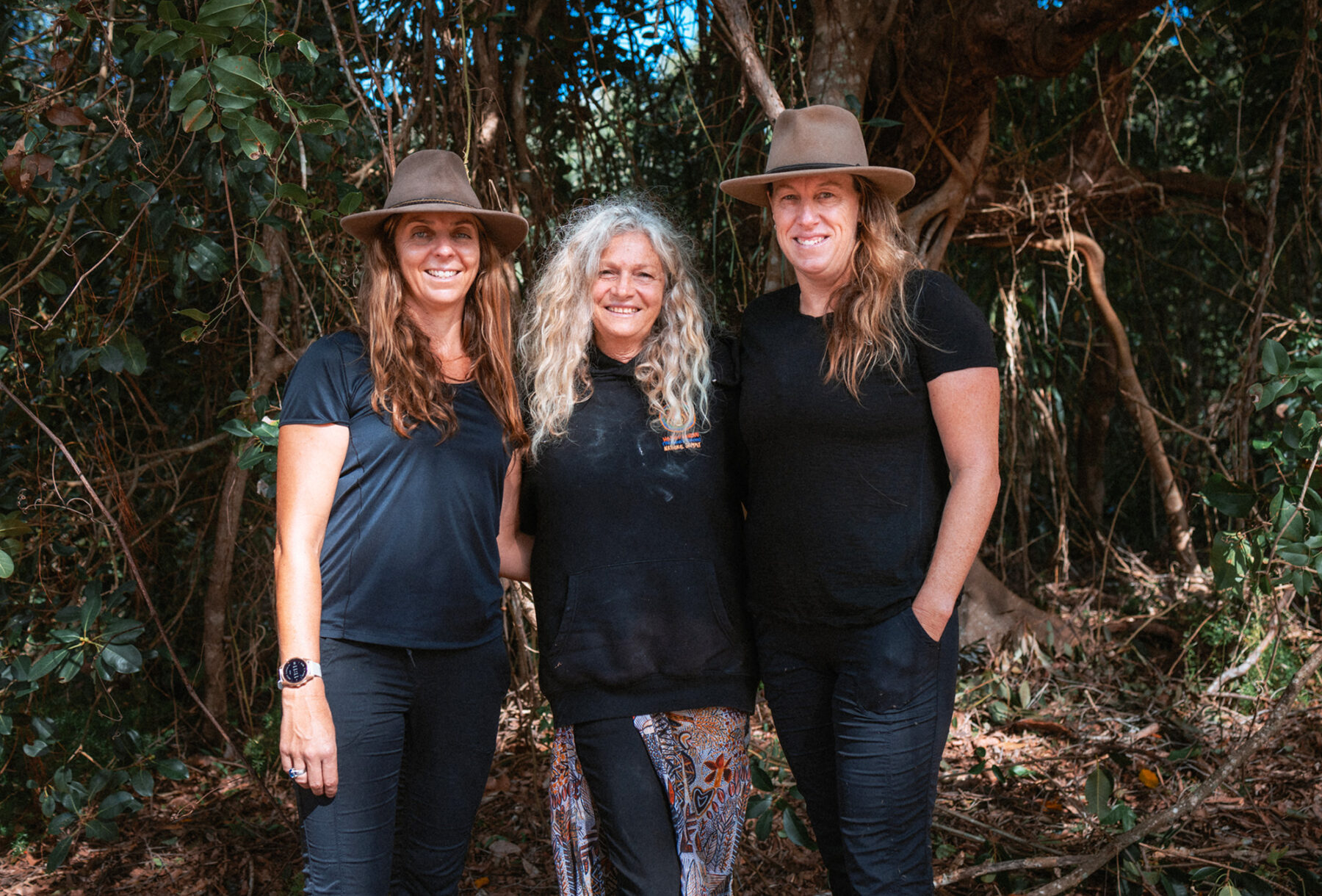 Positive Energy Retreats’ Peta Alexopoulos (left) and Belinda Johnson (right) with local Birpai/ Dhanggati woman, Aunty Rhonda Radley