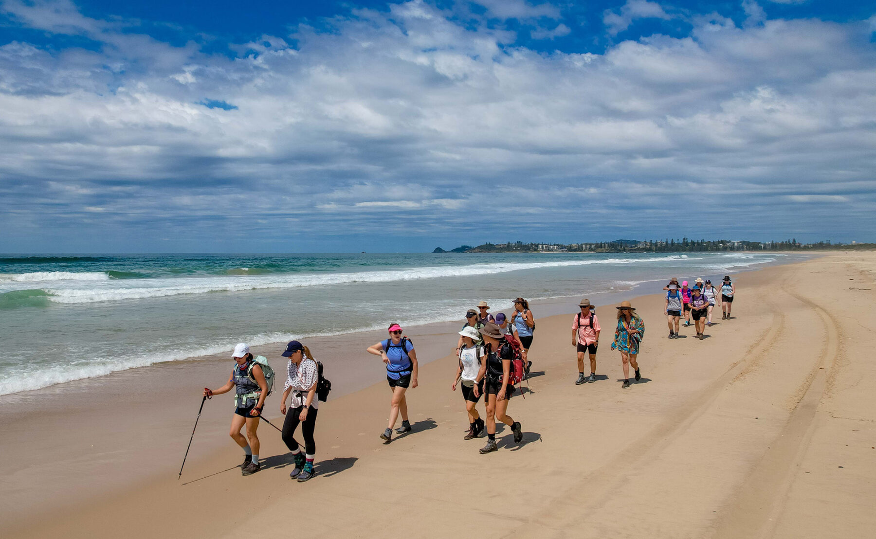 The Positive Energy Retreats guided group enjoys one of the beach walking sections of the three-day trek