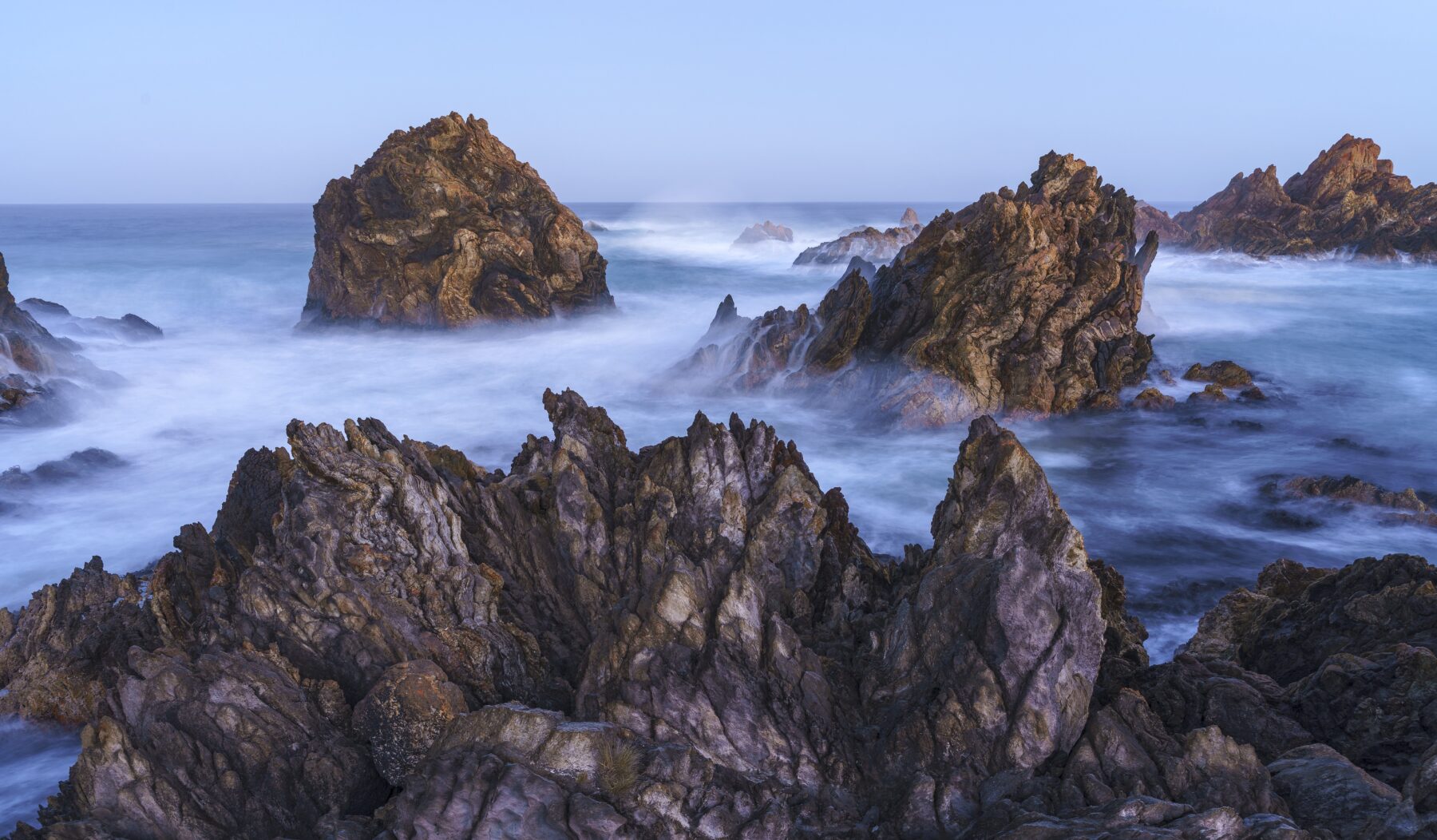 Contorted rocks and sea stacks rise from the ocean at Rupert Point near Tarkine