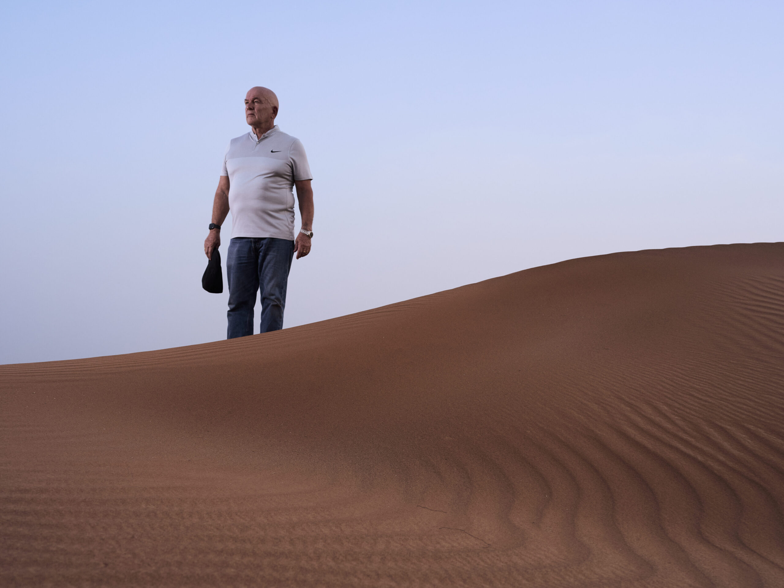 Dr Alex Tinson on red sand dunes