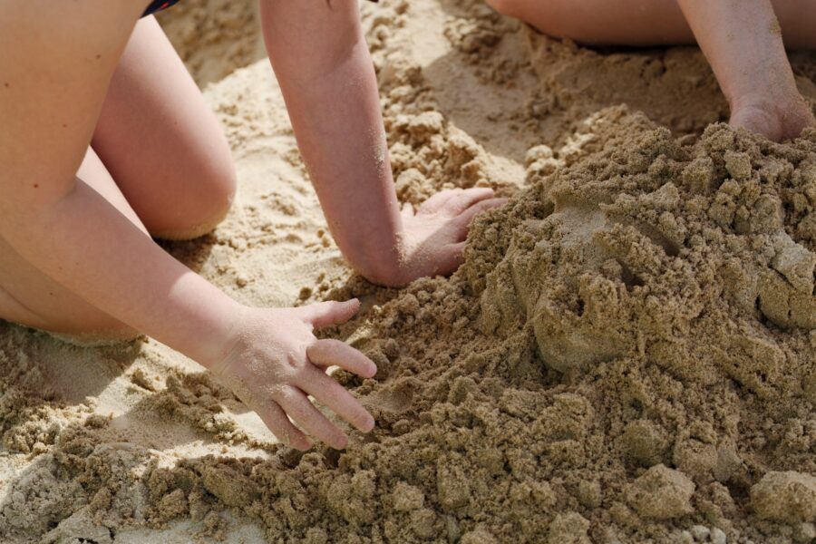 Children playing in beach sand