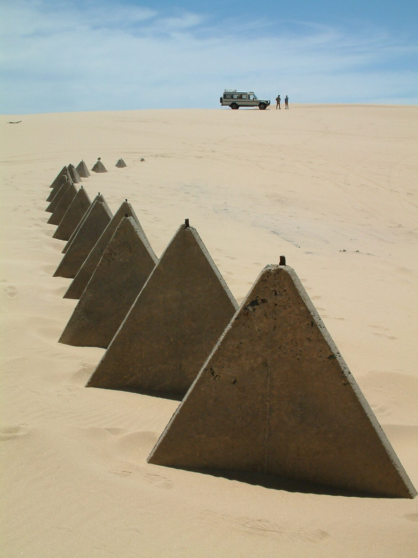 Remnants of concrete tetrahedron (triangular pyramid) World War II tank traps on Stockton Beach