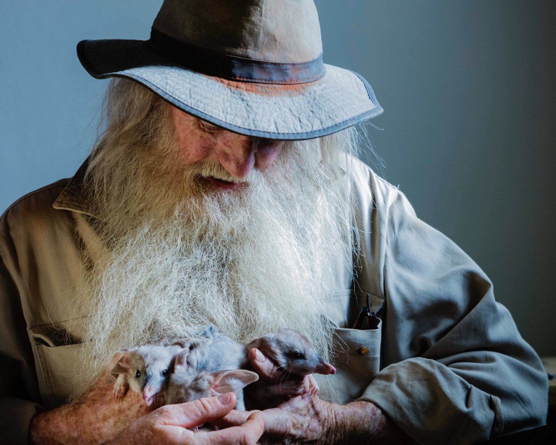 Peter McRae, holding bilbies in his arms