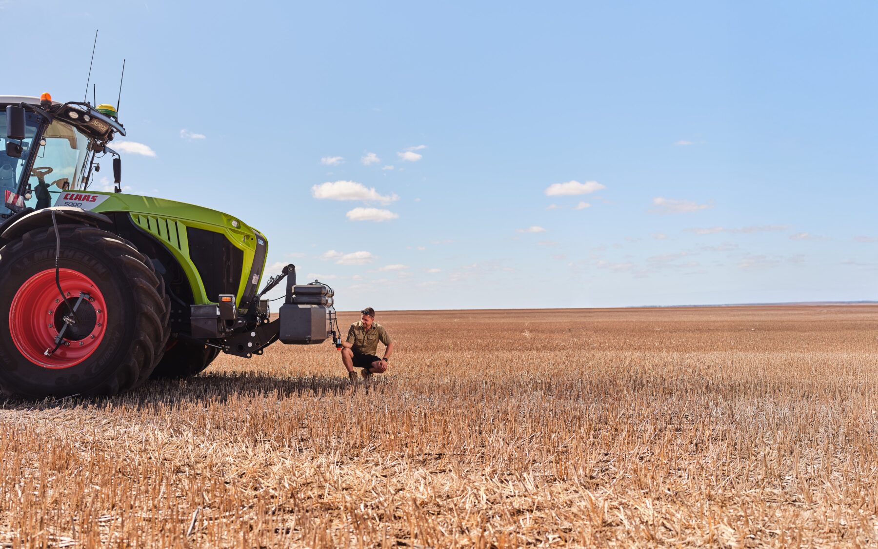 Rain Plaado inspects his SnailCam unit installed on a tractor at Pinehills Pastoral, around 61km from Esperance in WA