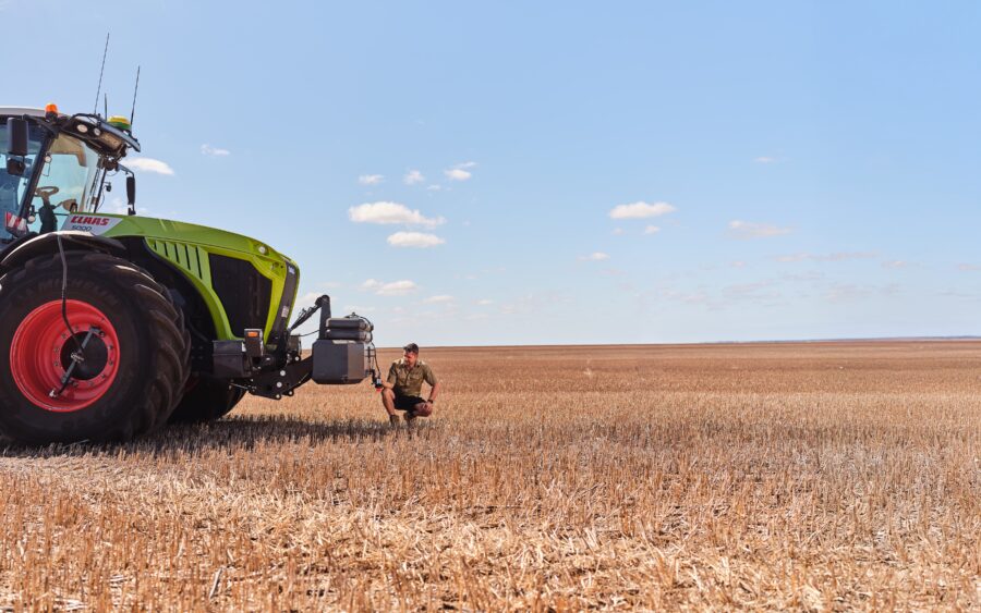 Rain Plaado inspects his SnailCam unit installed on a tractor at Pinehills Pastoral, around 61km from Esperance in WA