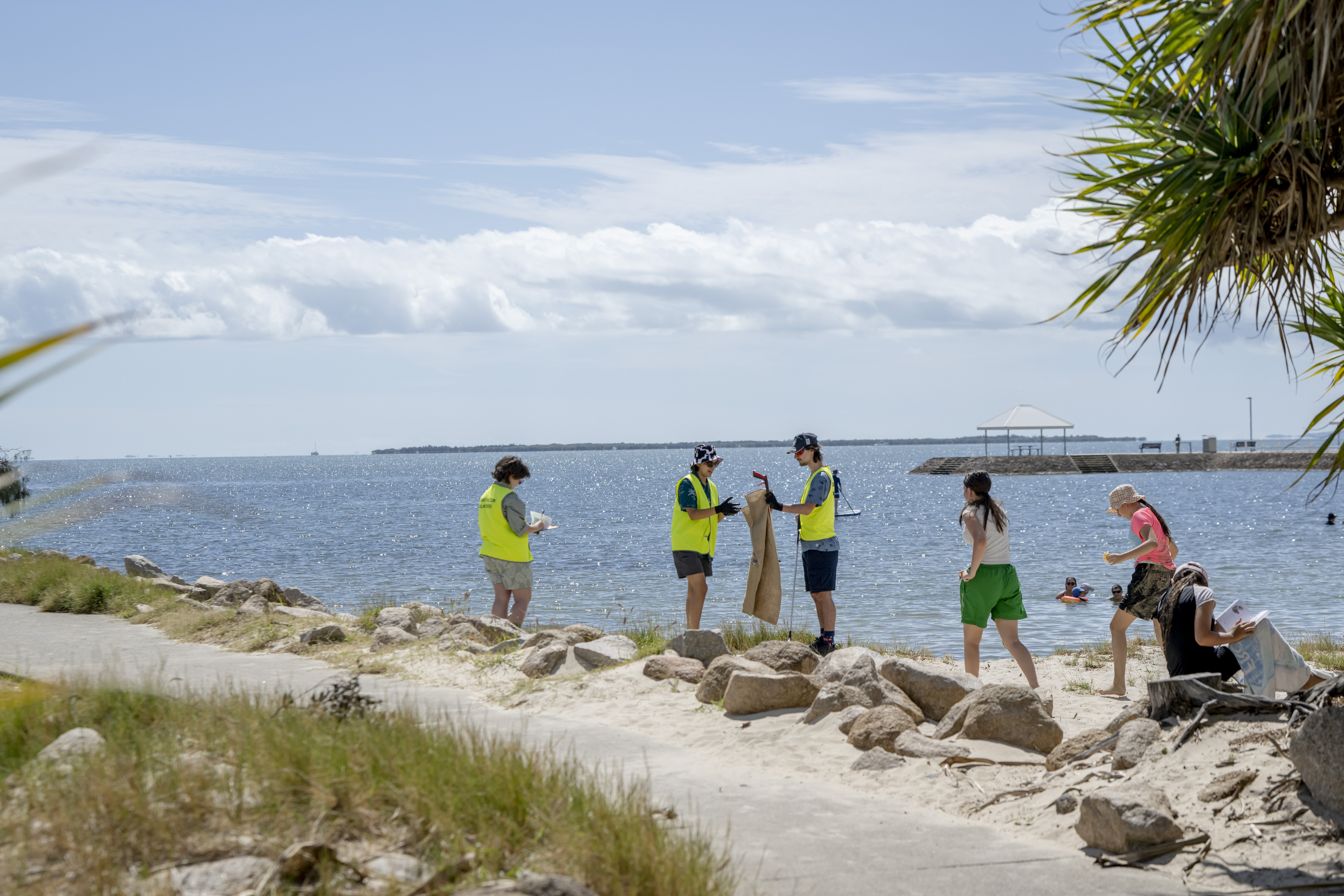 Members of Conservation Volunteers Australia clean up plastic litter in Moreton Bay in Brisbane
