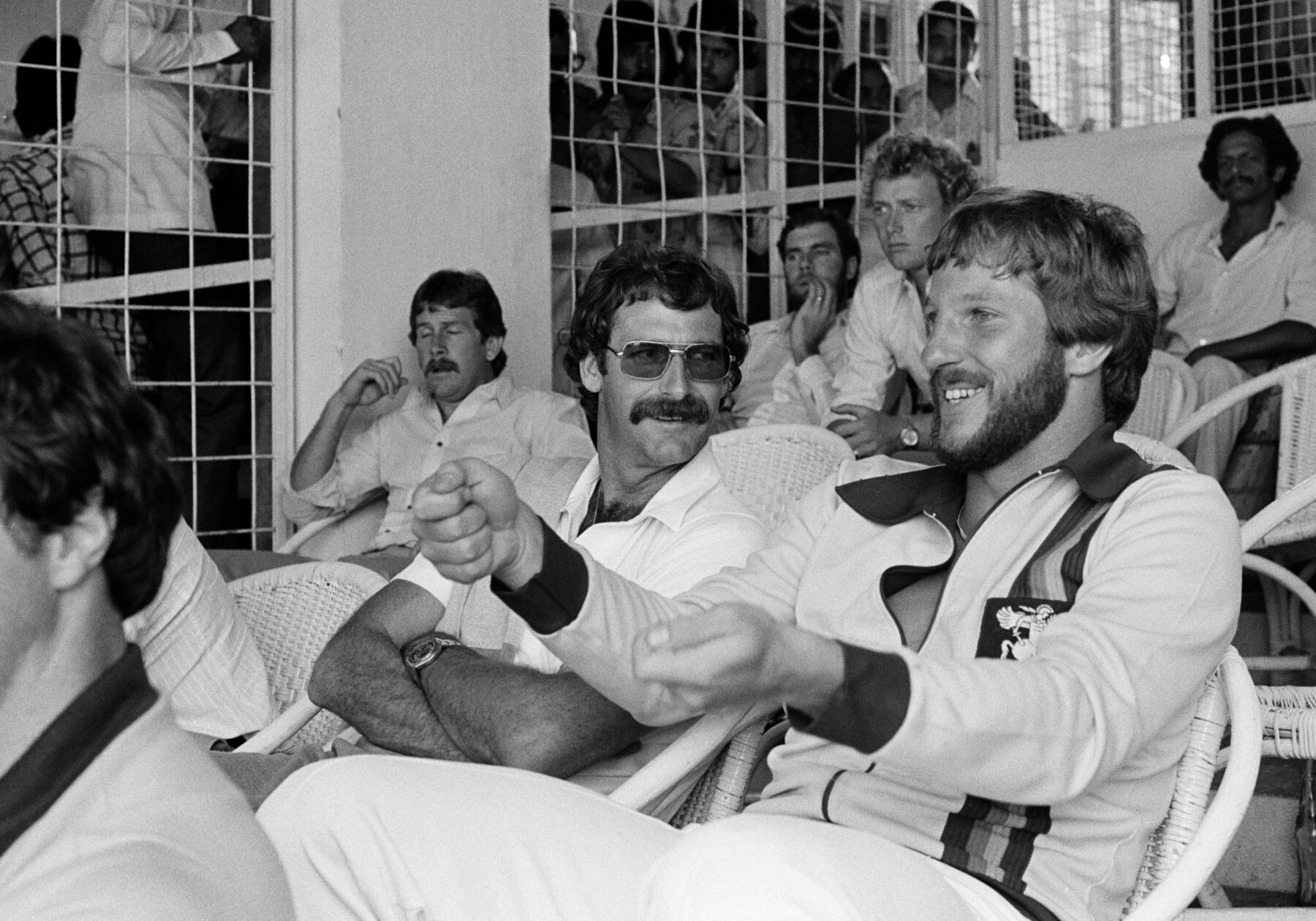 Australian pace legend Dennis Lillee (front left) and former England captain Ian Botham strike up a chat in 1980