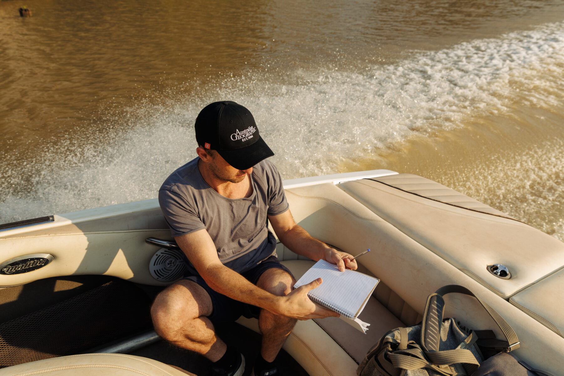 Adam Scroggy on a boat on the Balonne River