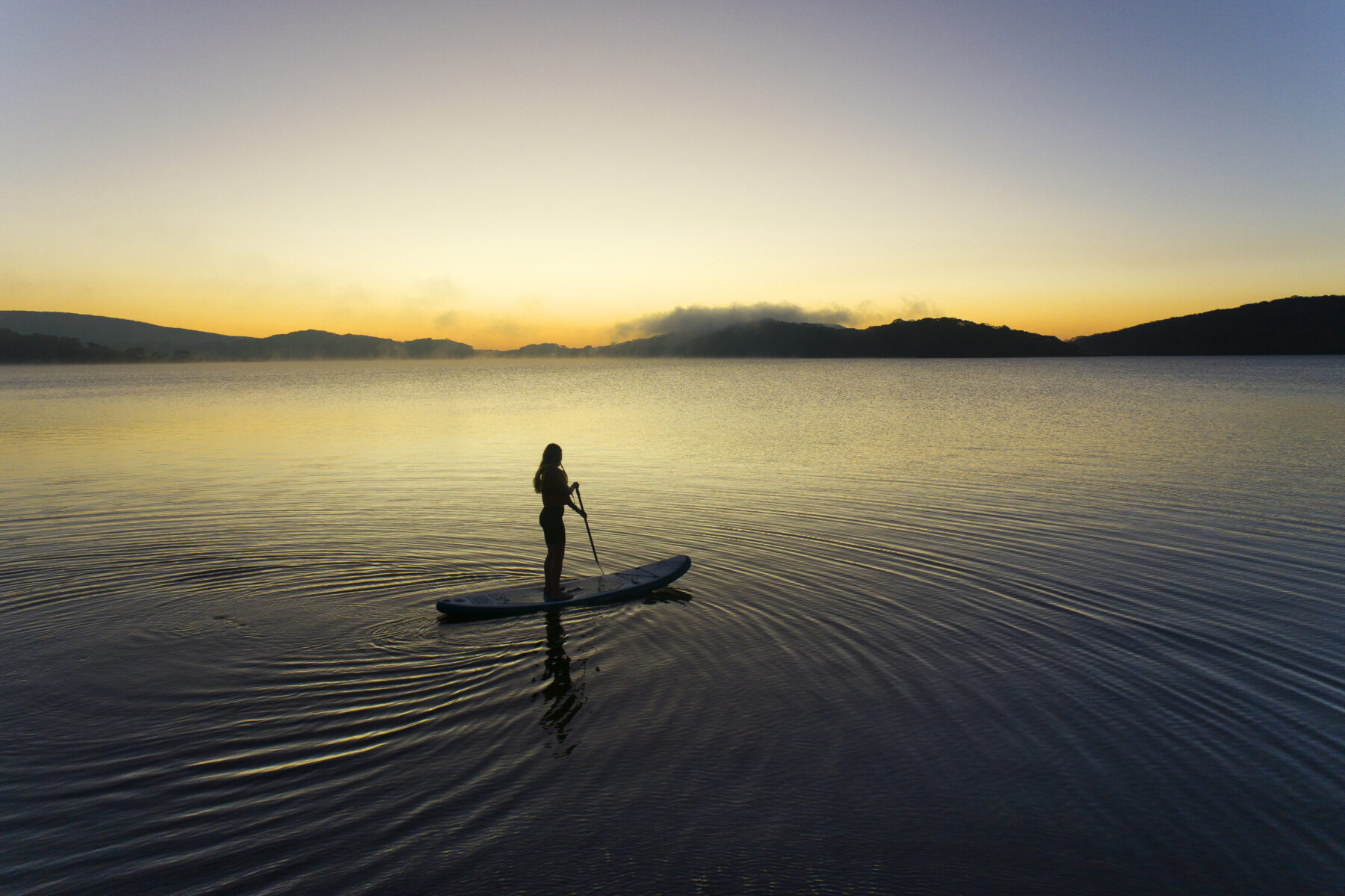 A paddleboarder on Rocky Valley Lake